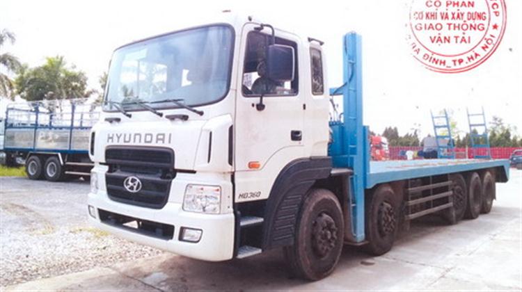 Xe tải Hyundai HD360 nâng đầu chở máy công trình